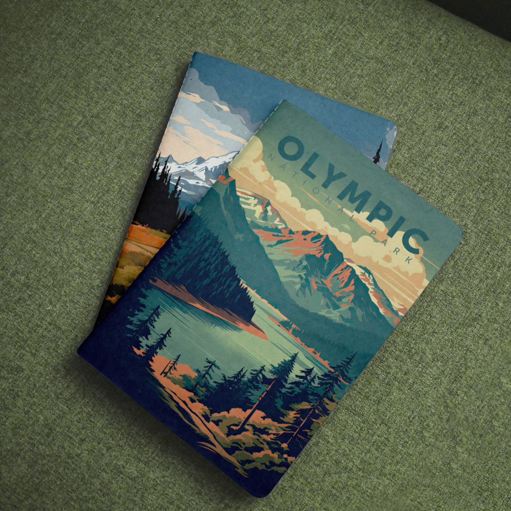 Olympic National Park pocket notebook with a teal lake and evergreen forest cover on green fabric.