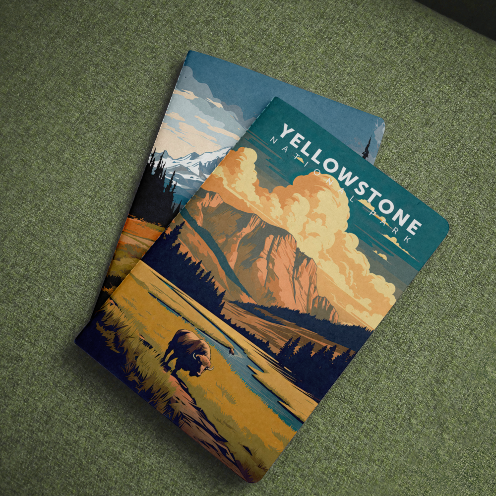 Yellowstone National Park pocket notebook with a bison in a golden meadow cover on green fabric.