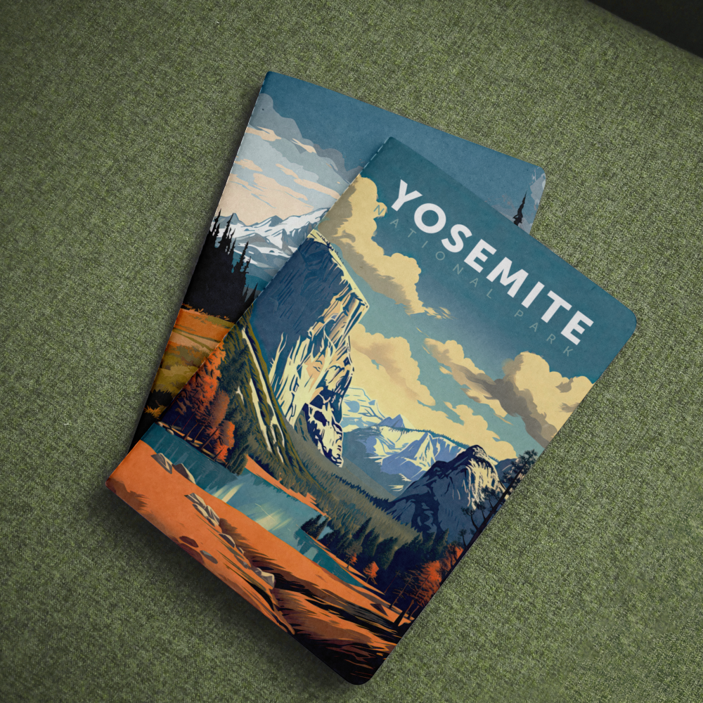 Yosemite National Park pocket notebook with a granite cliff and valley cover on green fabric.