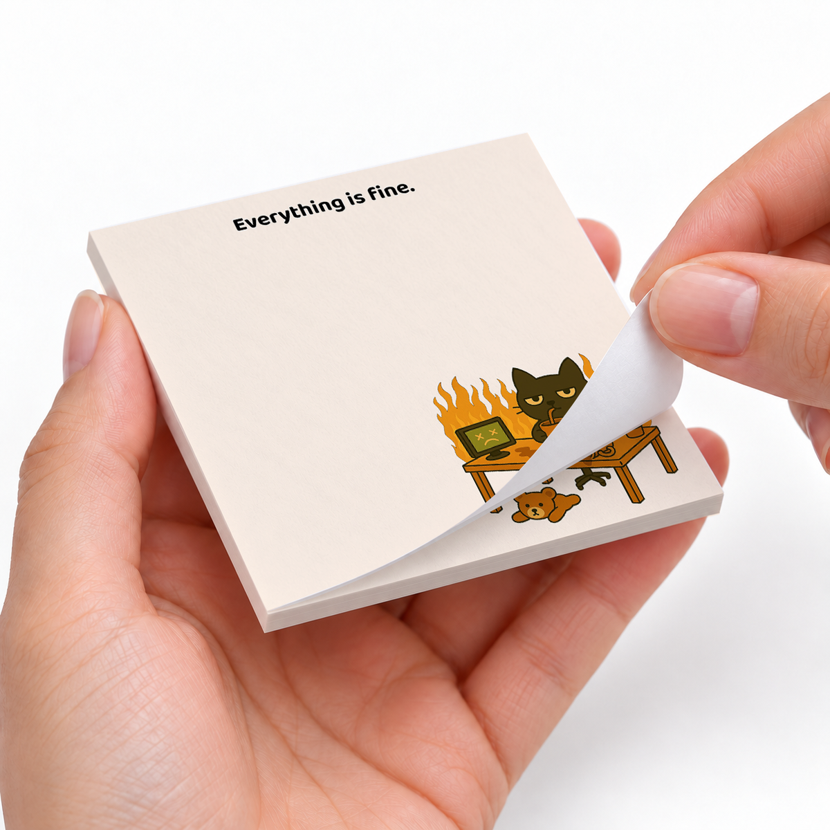 Everything Is Fine Fire Cat sticky notes styled with a planner and desk accessories