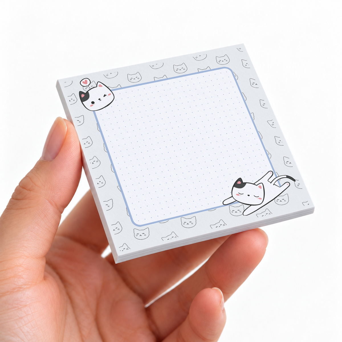 Stretching Cat Dotted Grid sticky note pad on a desk with stationery