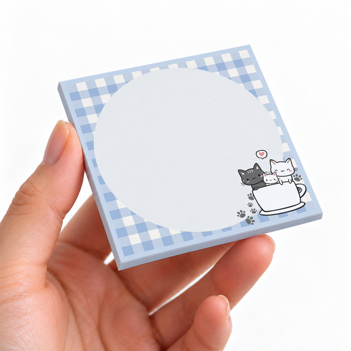 Cats in a Teacup Circular sticky note pad on a desk with stationery