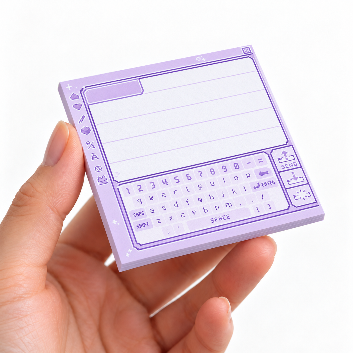 Pastel Purple Retro Pixel Keyboard sticky note pad on a desk with stationery