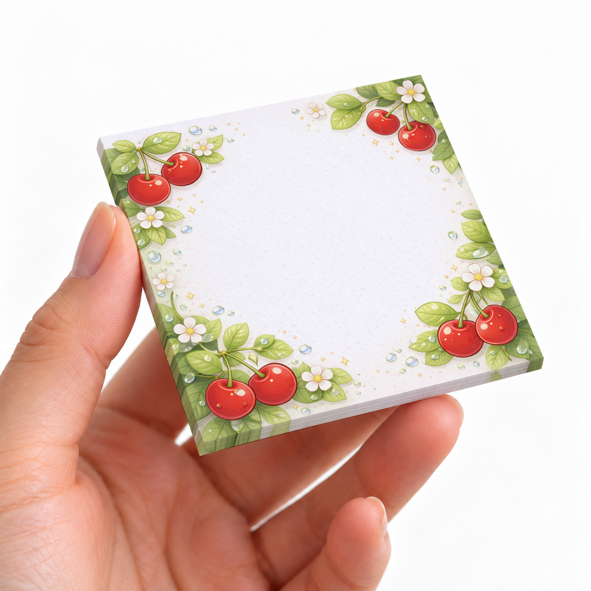 Dewy Cherry Blossom sticky note pad on a desk with stationery