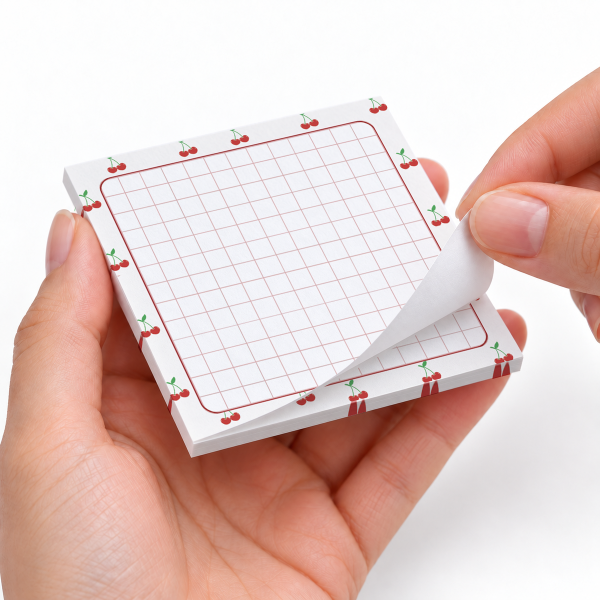 Cherry Border Grid sticky notes styled with a planner and desk accessories