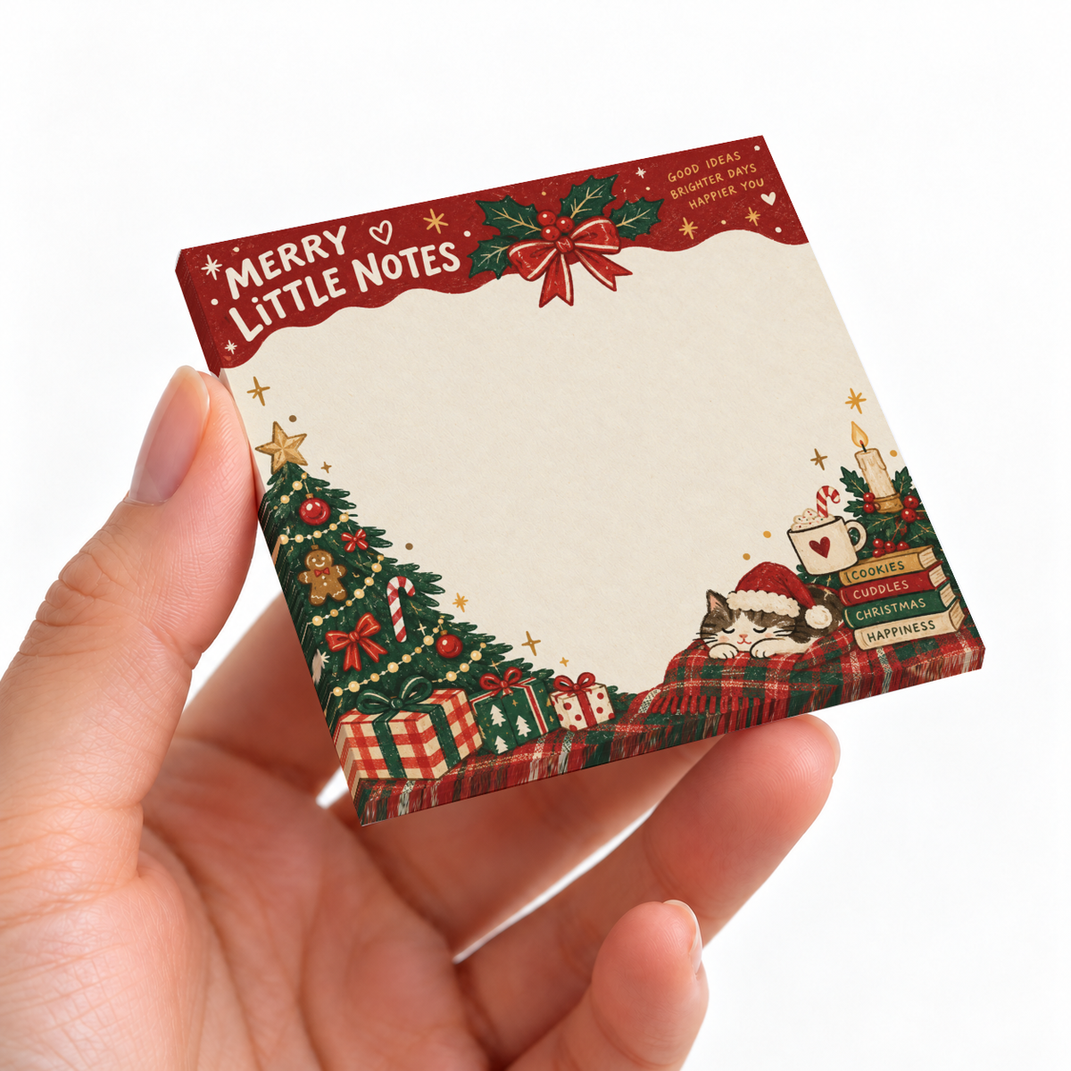 Hand holding a Merry Little Notes sticky note pad with a sleeping Santa cat, Christmas tree, gifts, and holly.
