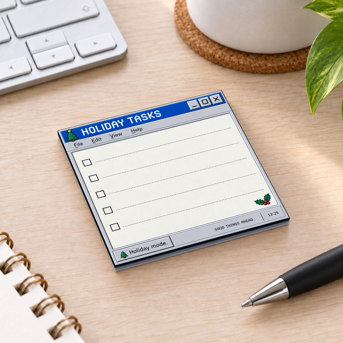 Retro Holiday Tasks checklist sticky note pad on a wood desk beside a keyboard, pen, notebook, and plant.