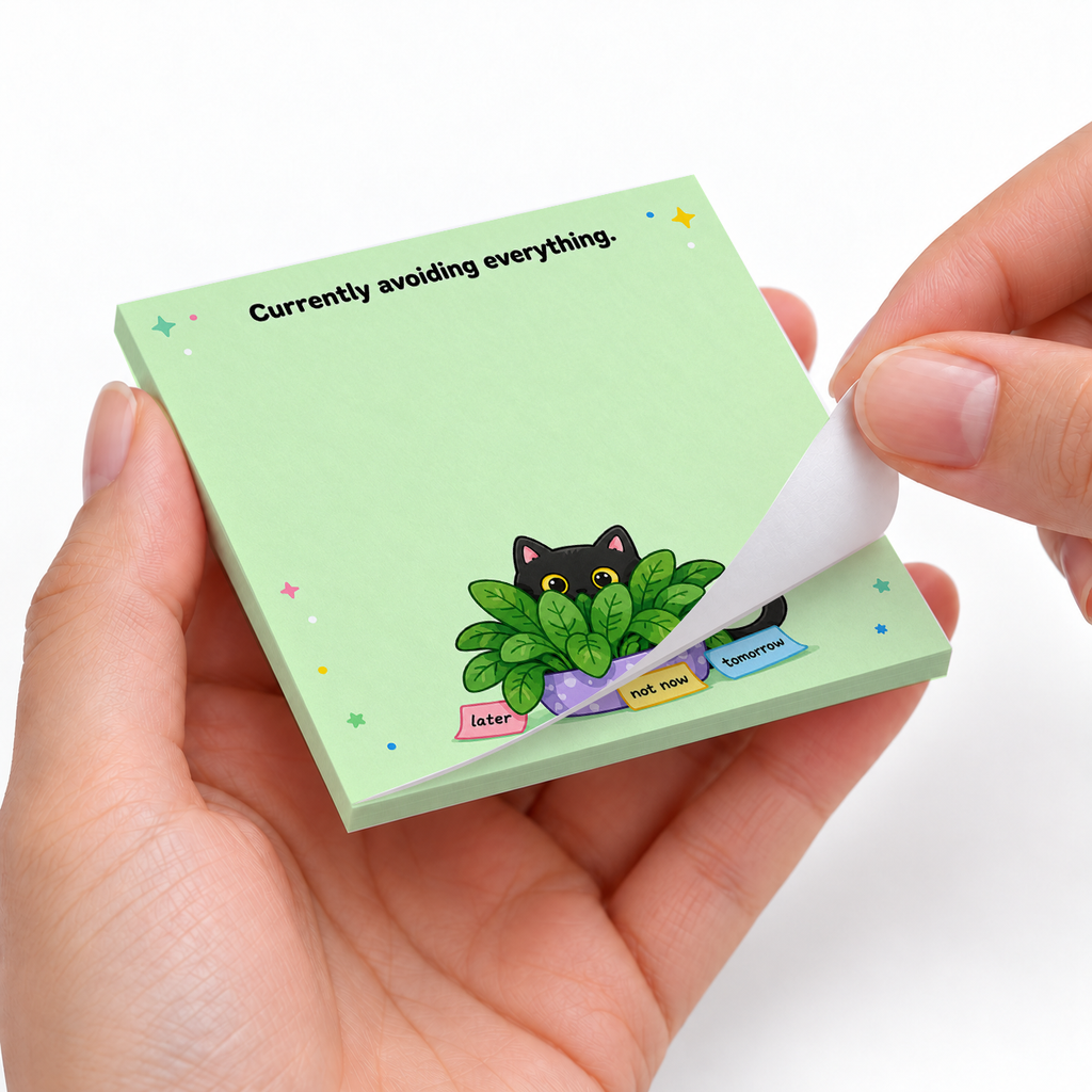 Avoiding Everything Plant Hiding Cat sticky notes styled with a planner and desk accessories
