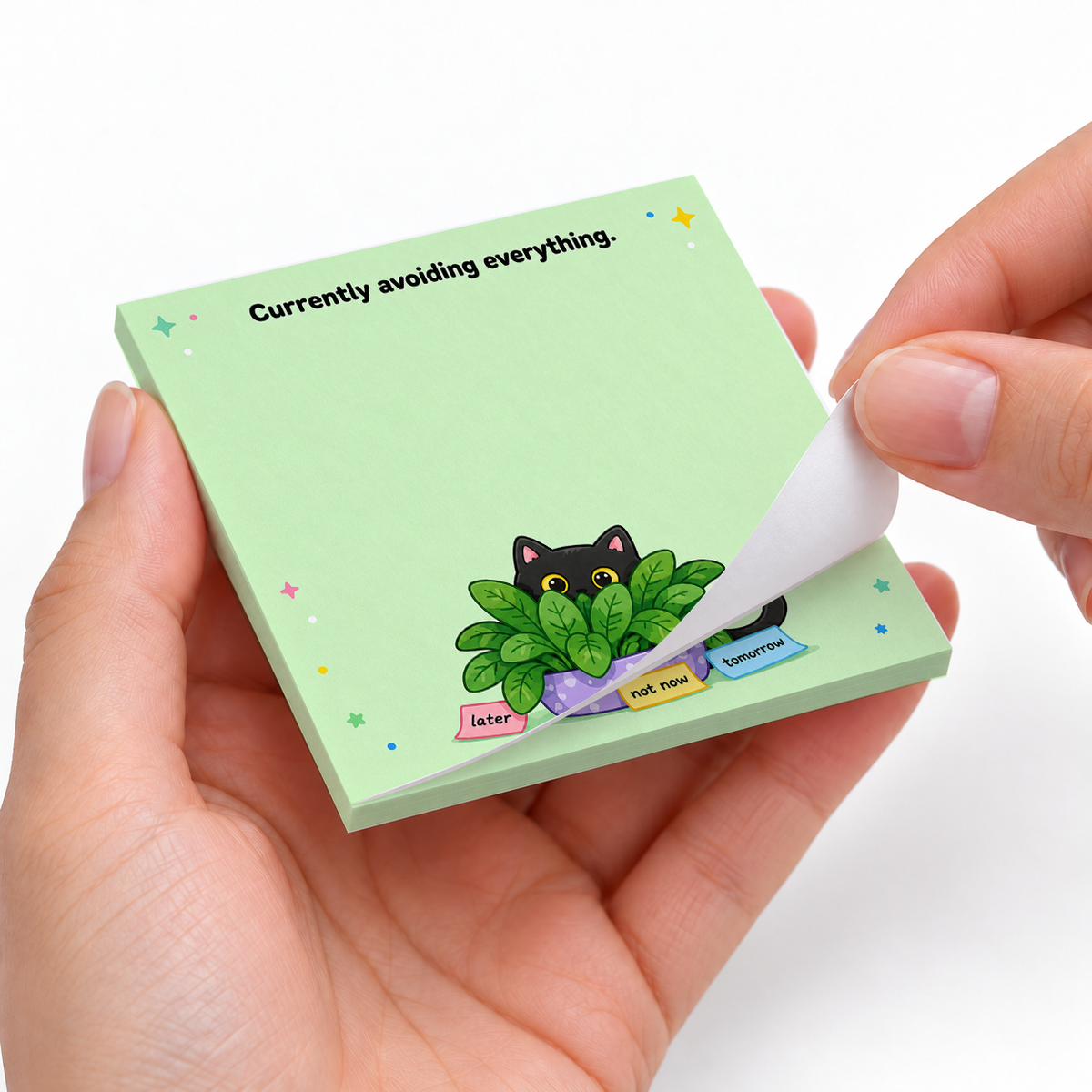 Avoiding Everything Plant Hiding Cat sticky notes styled with a planner and desk accessories