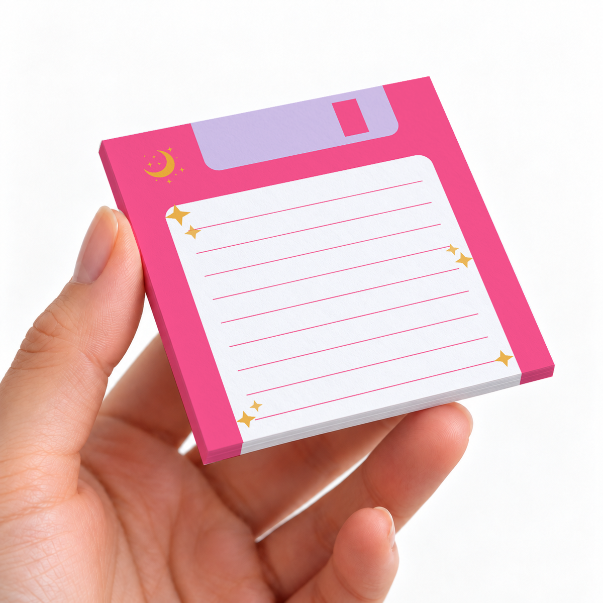 Pink Retro Floppy Disk Lined sticky note pad on a desk with stationery