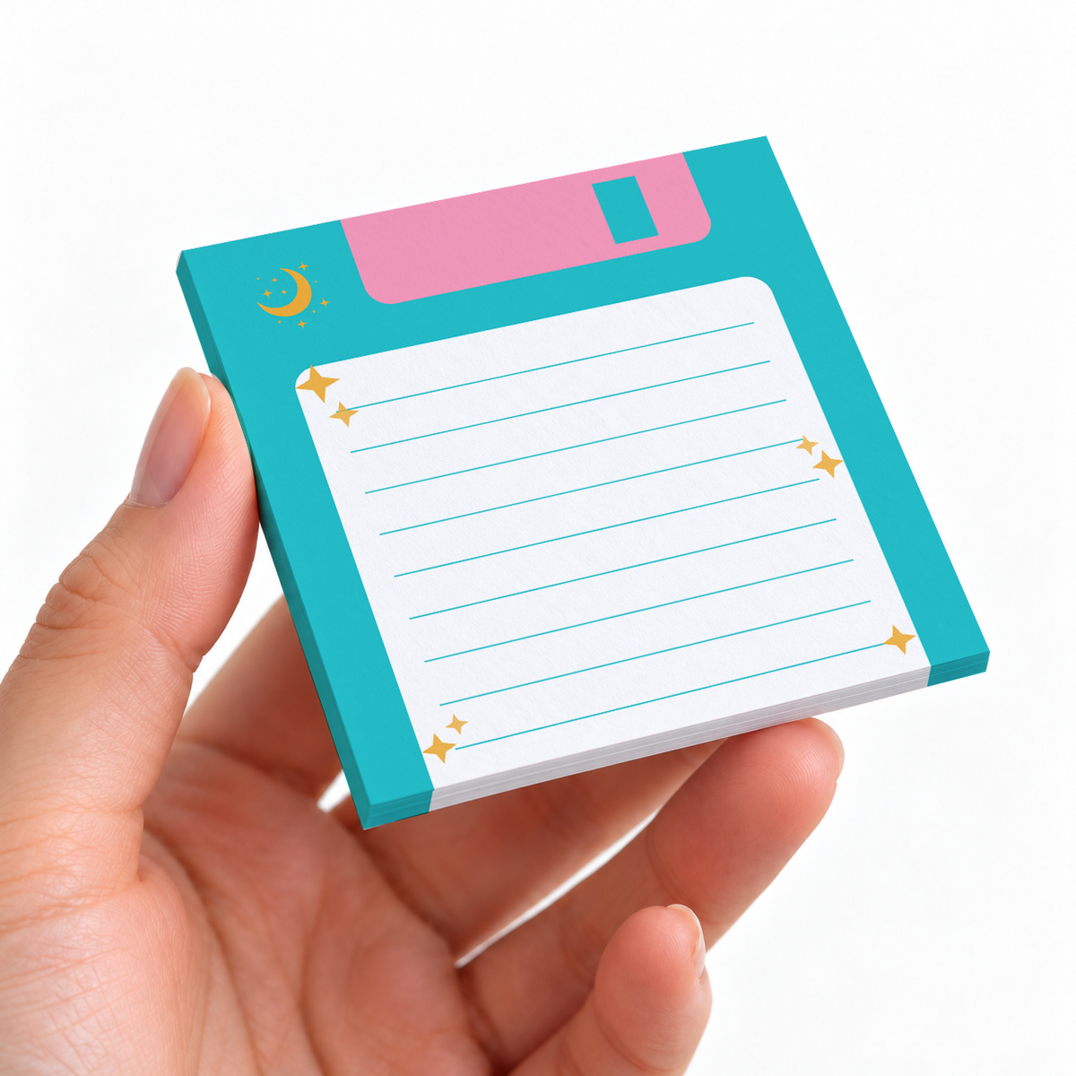 Teal Floppy Disk Lined sticky note pad on a desk with stationery
