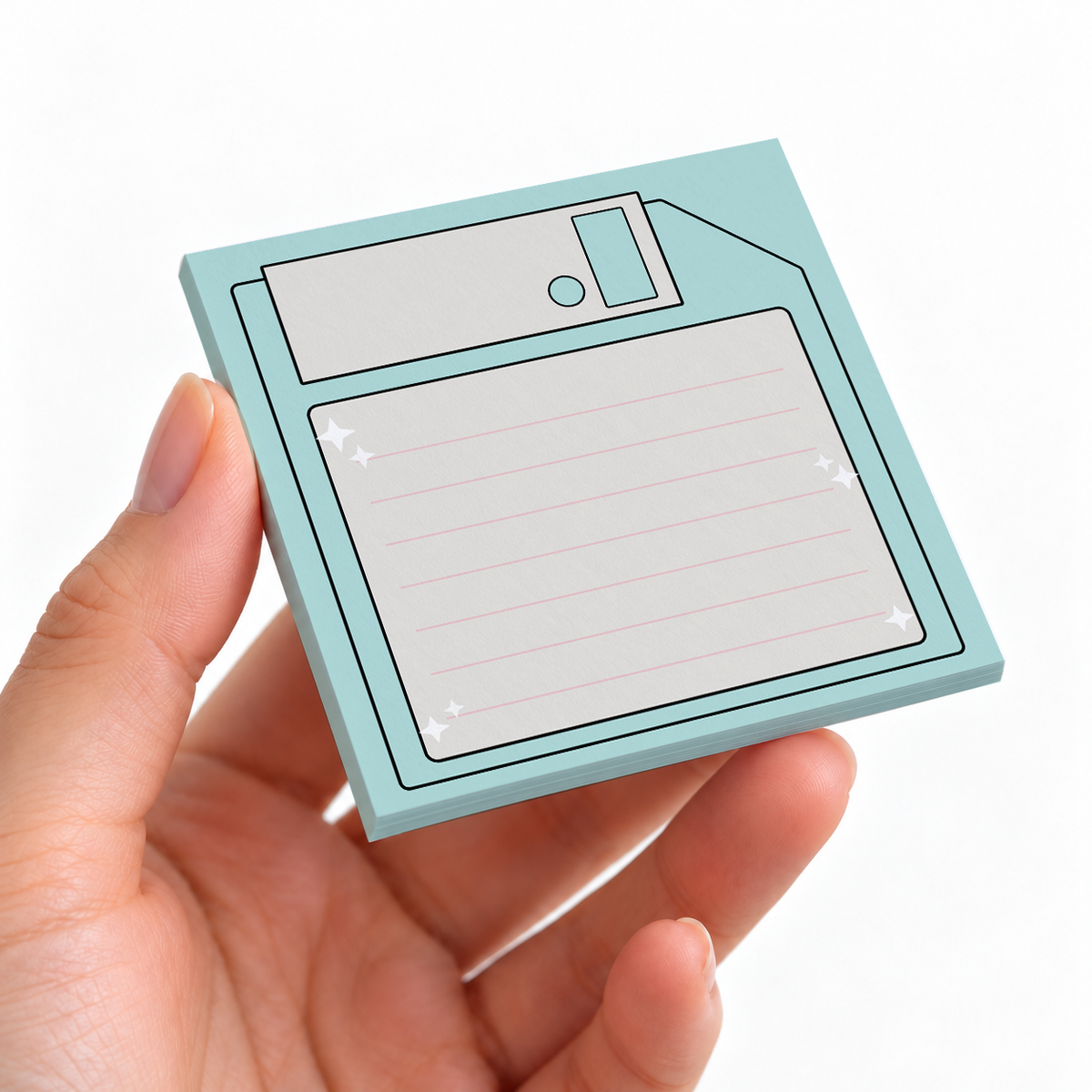 Mint Green Floppy Disk sticky note pad on a desk with stationery