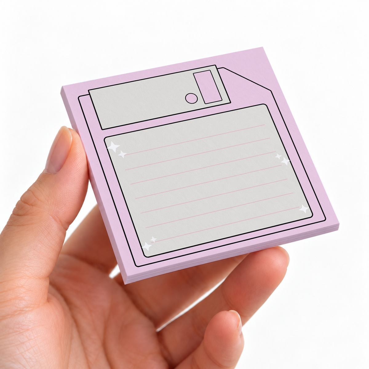 Pastel Pink Floppy Disk sticky note pad on a desk with stationery