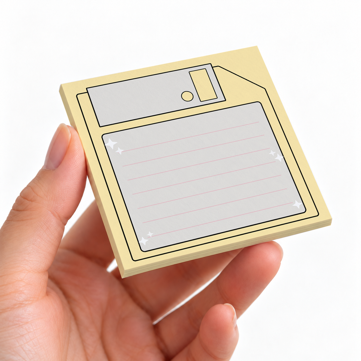 Pastel Yellow Floppy Disk sticky note pad on a desk with stationery