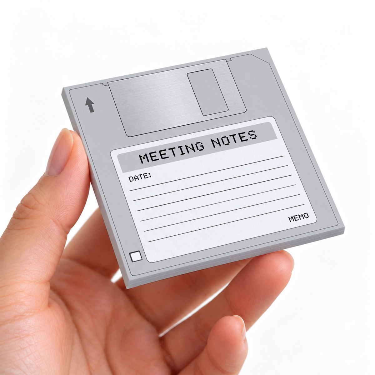 Gray Meeting Notes Floppy Disk sticky note pad on a desk with stationery