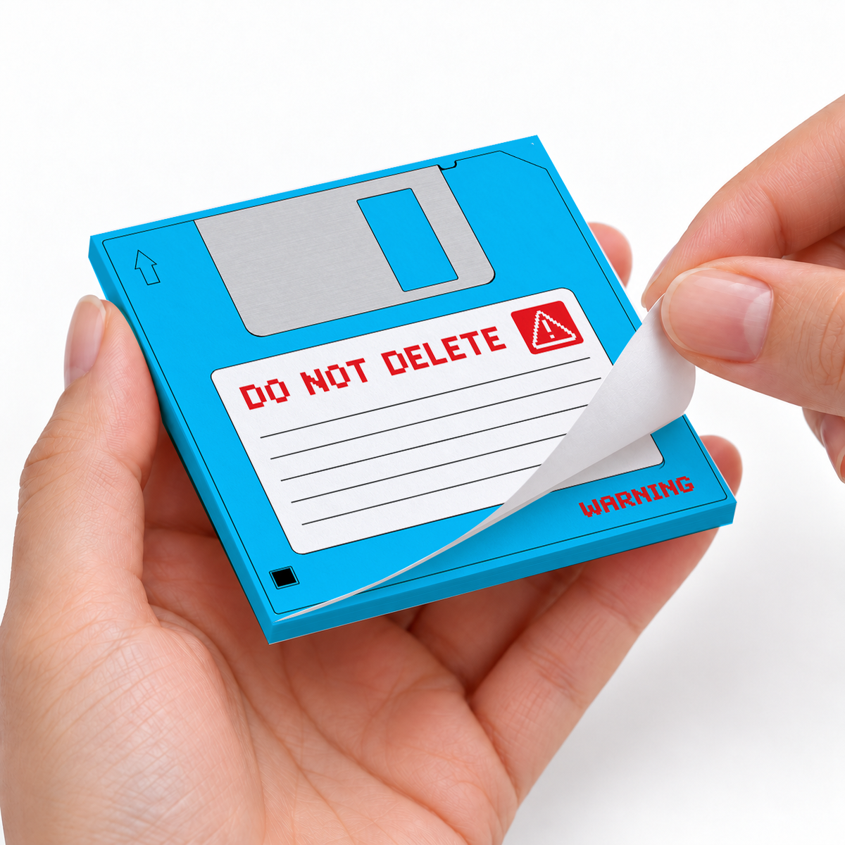 Blue Do Not Delete Floppy Disk sticky notes styled with a planner and desk accessories