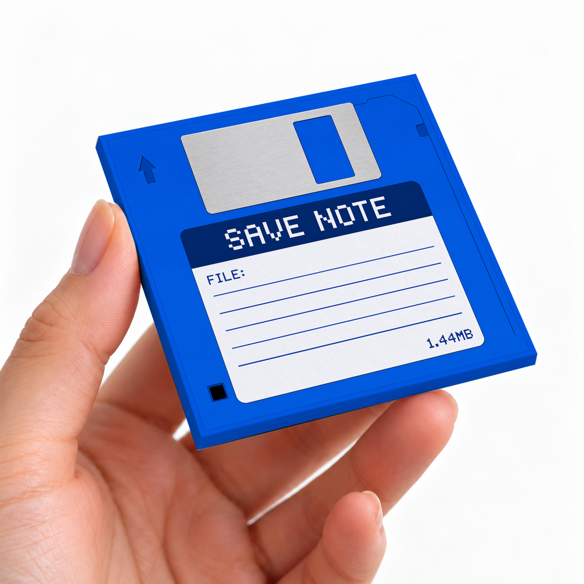 Blue Floppy Disk sticky note pad on a desk with stationery