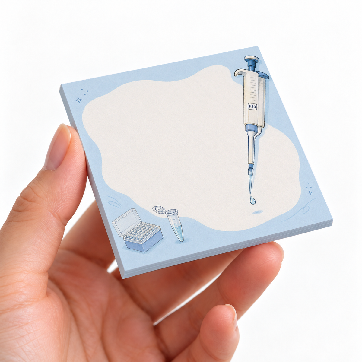 Lab Pipette & Tubes sticky note pad on a desk with stationery