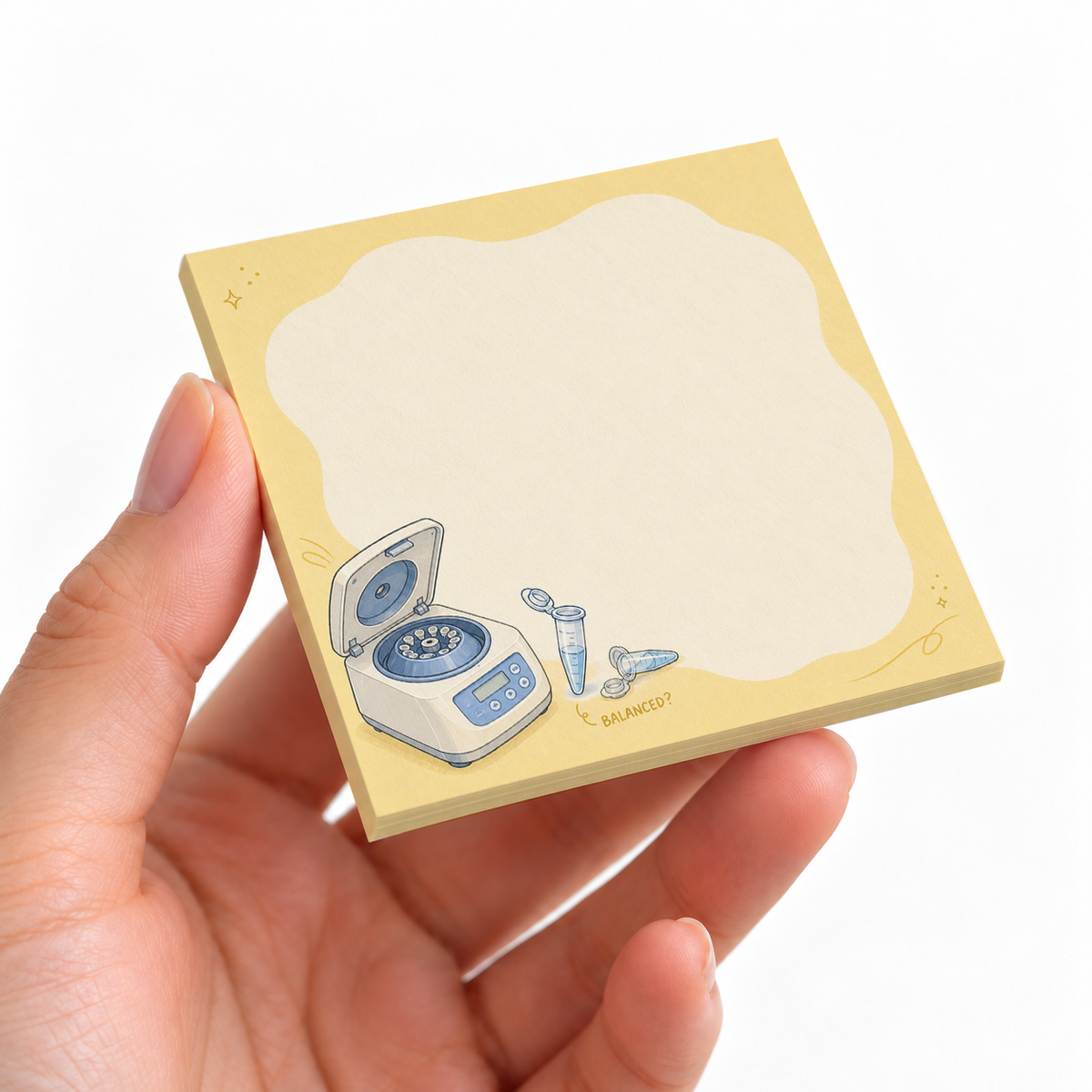Lab Centrifuge sticky note pad on a desk with stationery