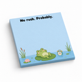 Blue 3 x 3 inch frog sticky note pad with “No rush. Probably.” above a lounging frog on a lily pad.