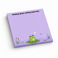 Purple 3 x 3 inch sticky note pad featuring a frog on a lily pad and the text “Thinking about nothing important.”