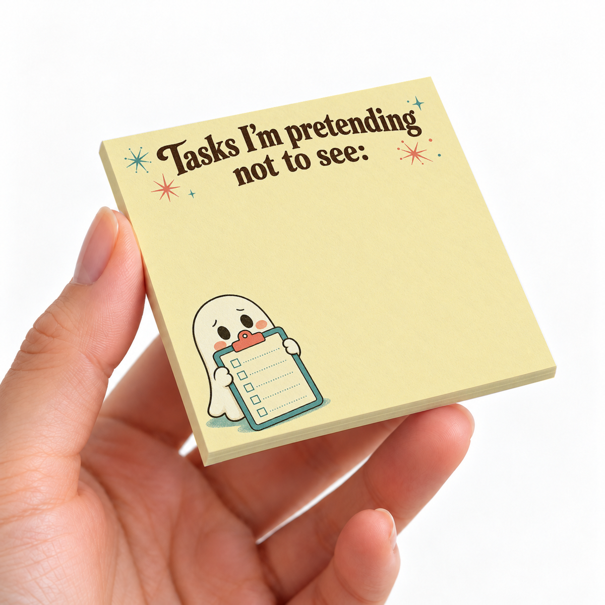 Pretending Not to See Ghost sticky note pad on a desk with stationery