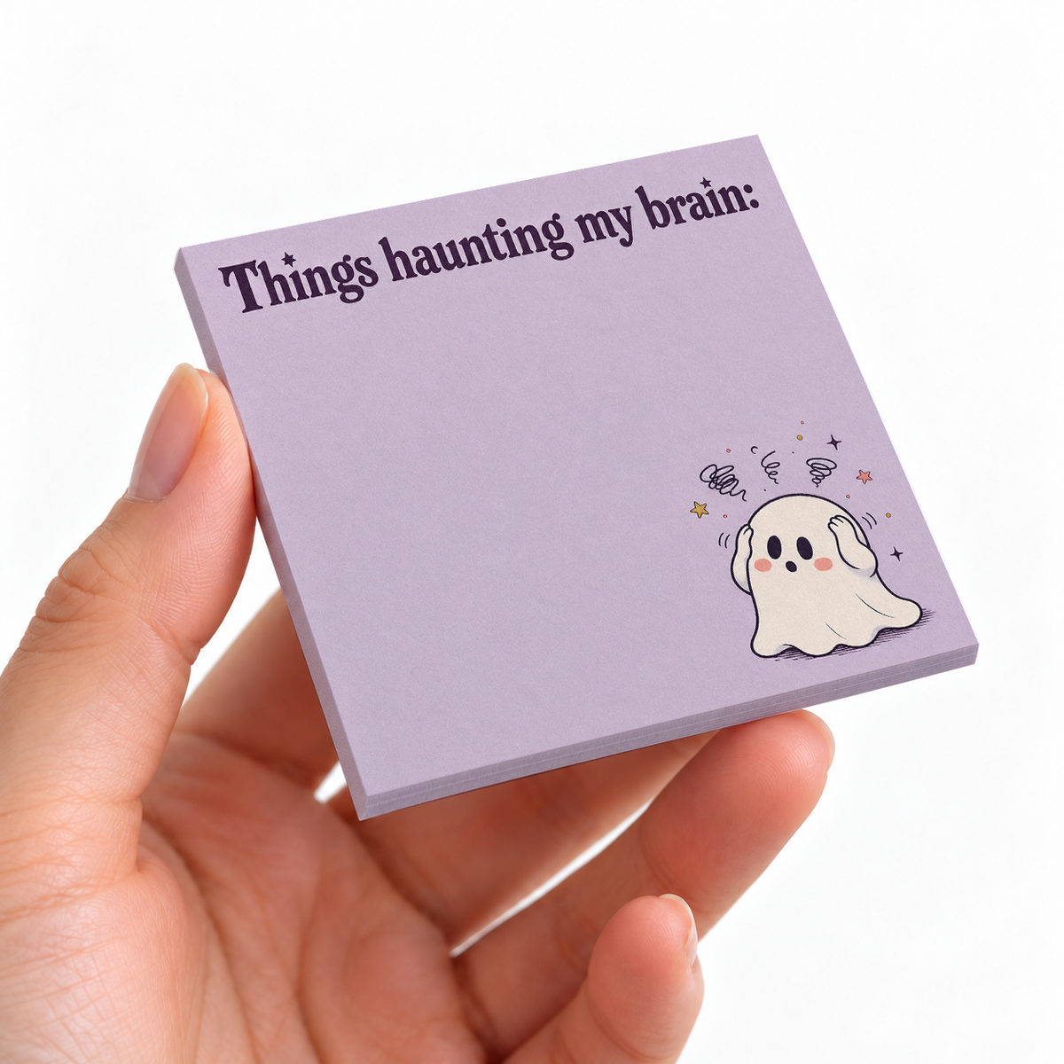 Haunting My Brain Ghost sticky note pad on a desk with stationery