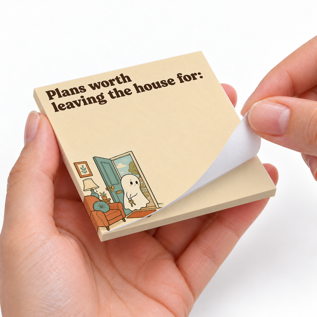 Introvert House Ghost sticky notes styled with a planner and desk accessories
