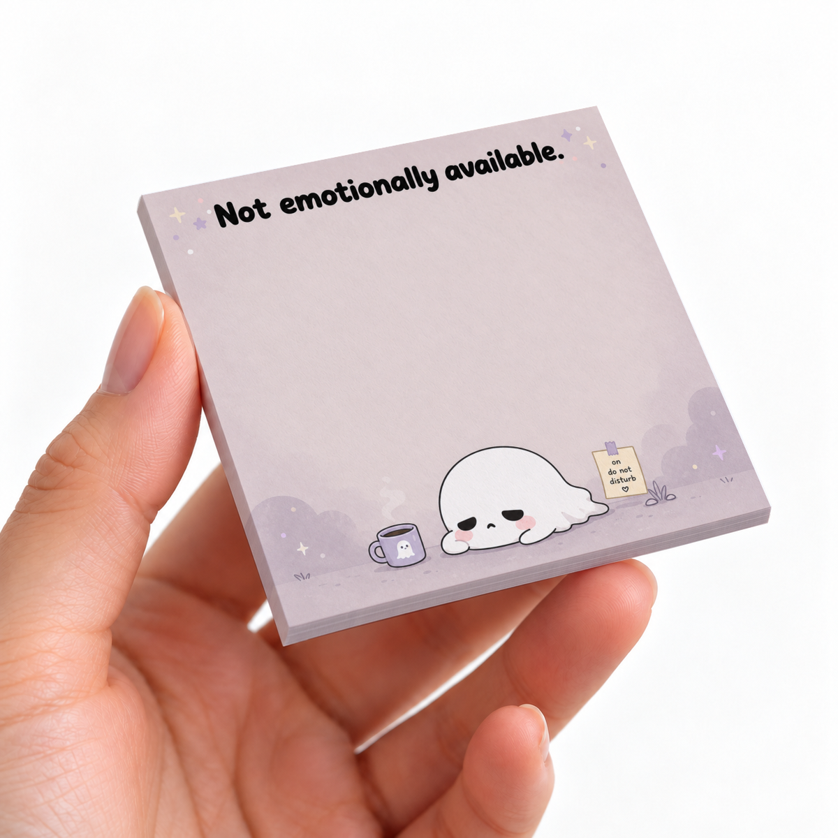 A hand holds a lavender sticky note pad with a sad ghost and “Not emotionally available” text.