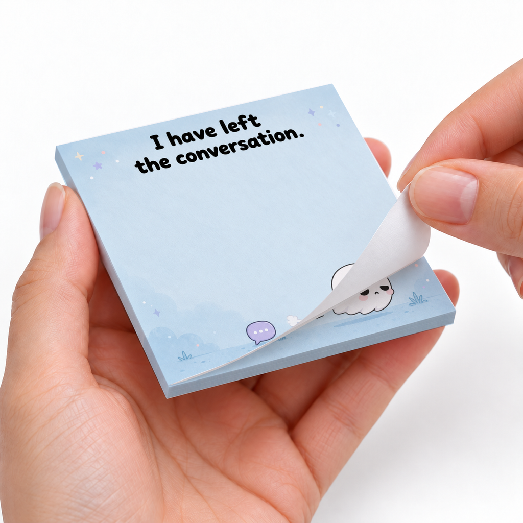 Hands peel a sheet from a blue sticky note pad printed with “I have left the conversation” and a cute ghost.