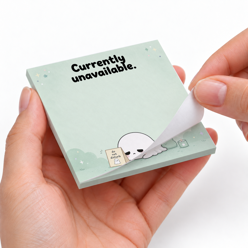 Hands peel a sheet from mint Sleepy Ghost sticky notes featuring a resting ghost and “Currently unavailable.”