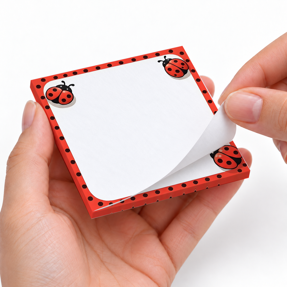 Red Polka Dot Ladybug sticky notes styled with a planner and desk accessories
