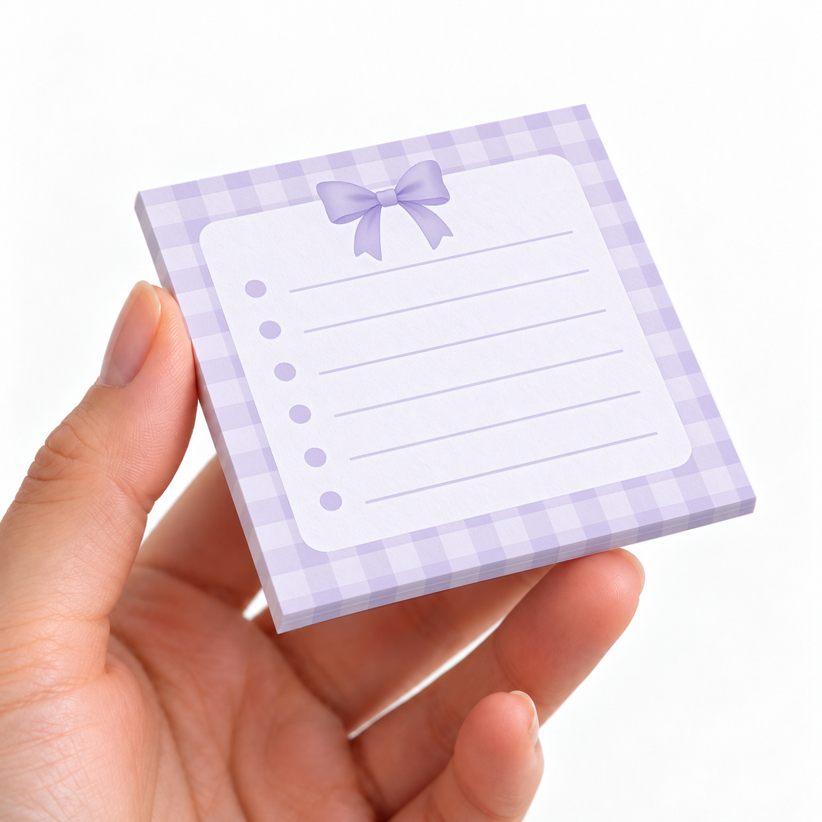 Top Bow Gingham sticky note pad on a desk with stationery