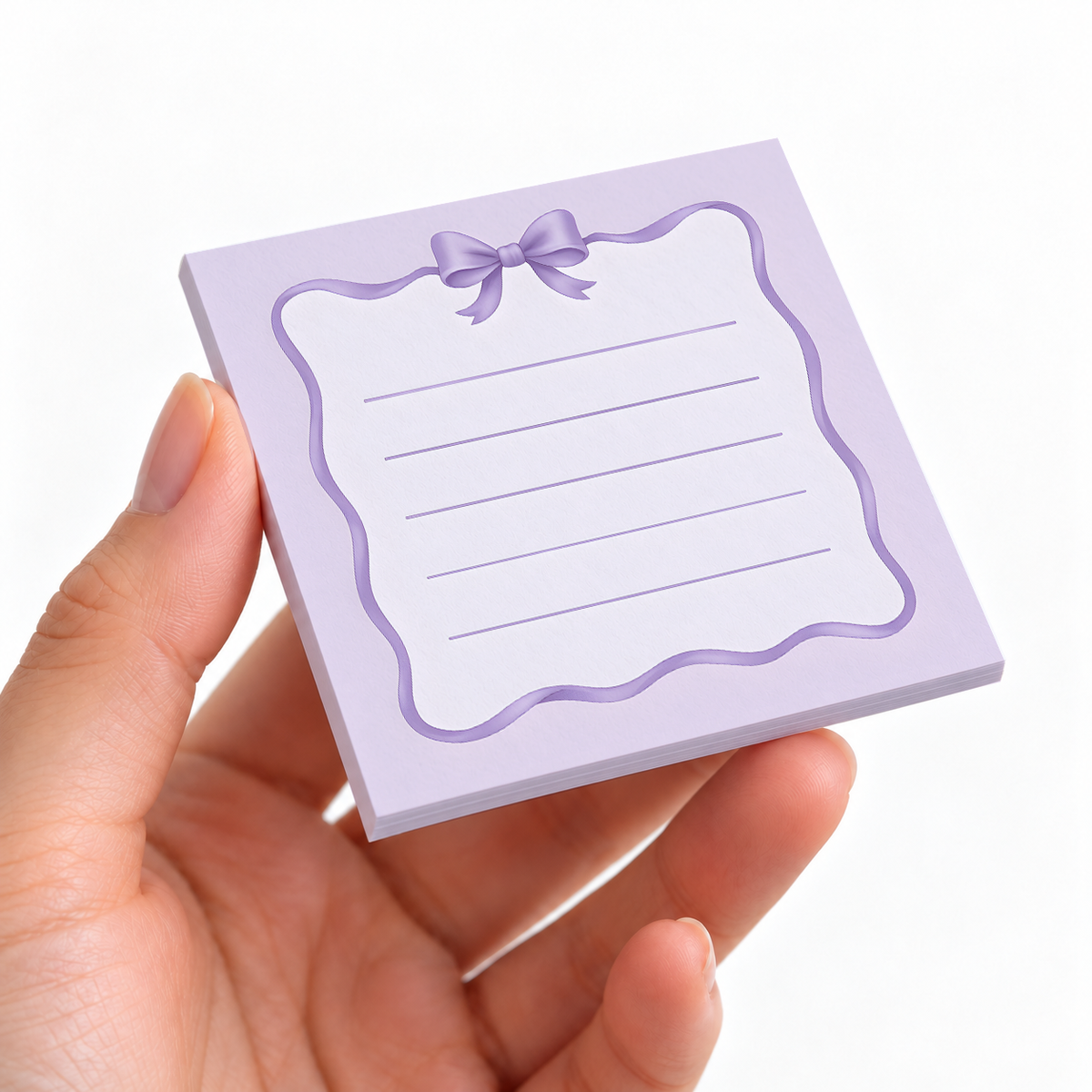 Wavy Ribbon Border sticky note pad on a desk with stationery