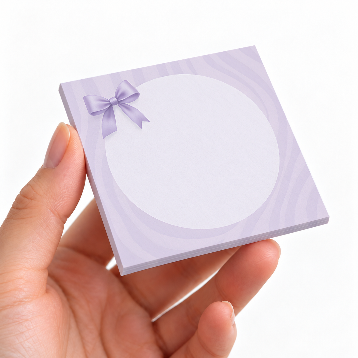Pastel Swirl Round Frame sticky note pad on a desk with stationery