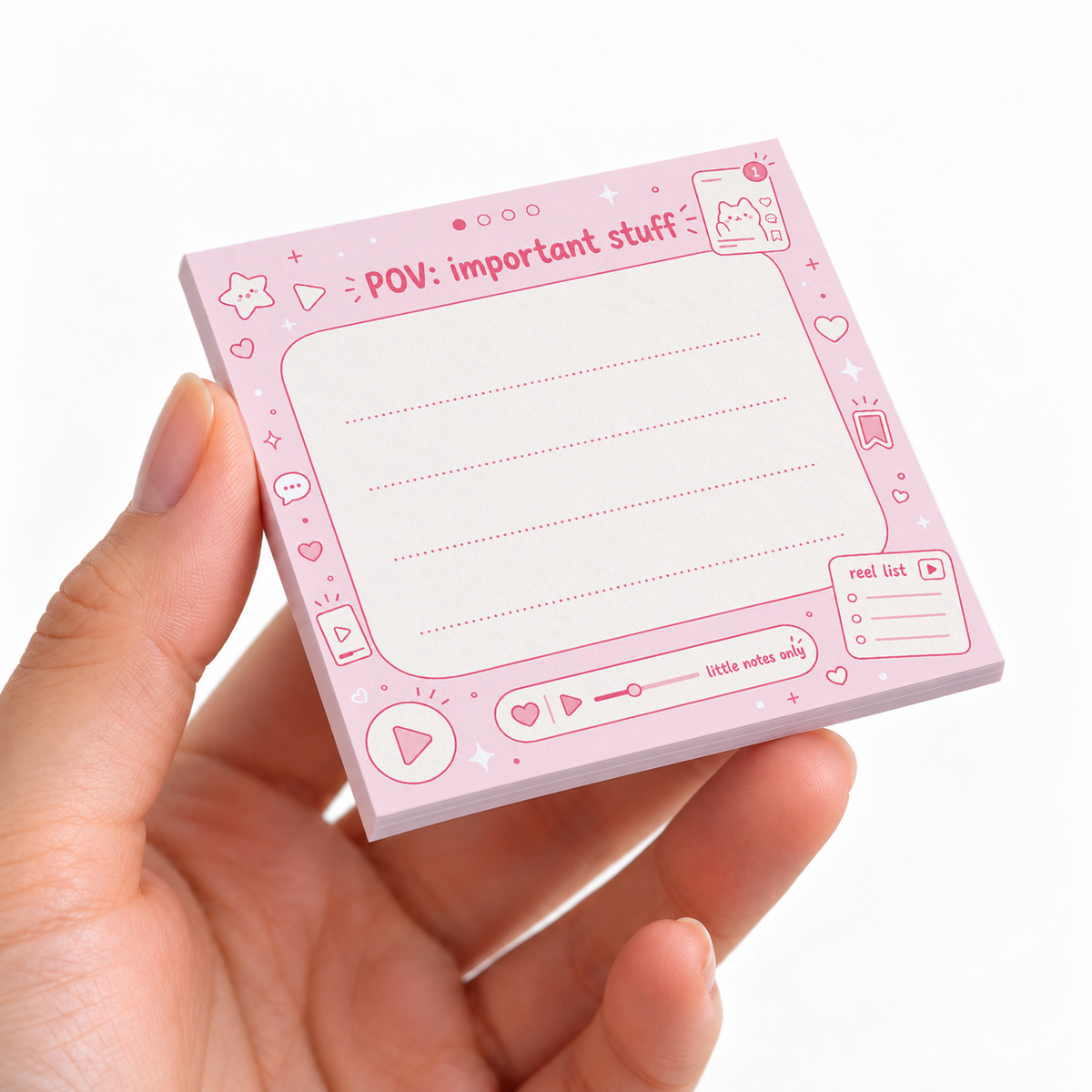 Pink POV Important Stuff sticky note pad on a desk with stationery