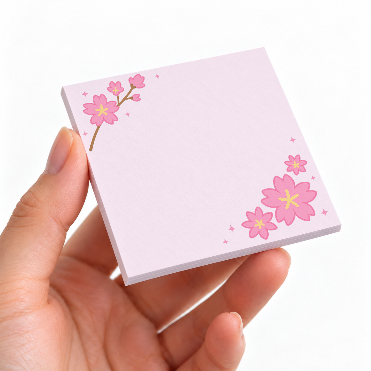 Sakura Branch Corner sticky note pad on a desk with stationery