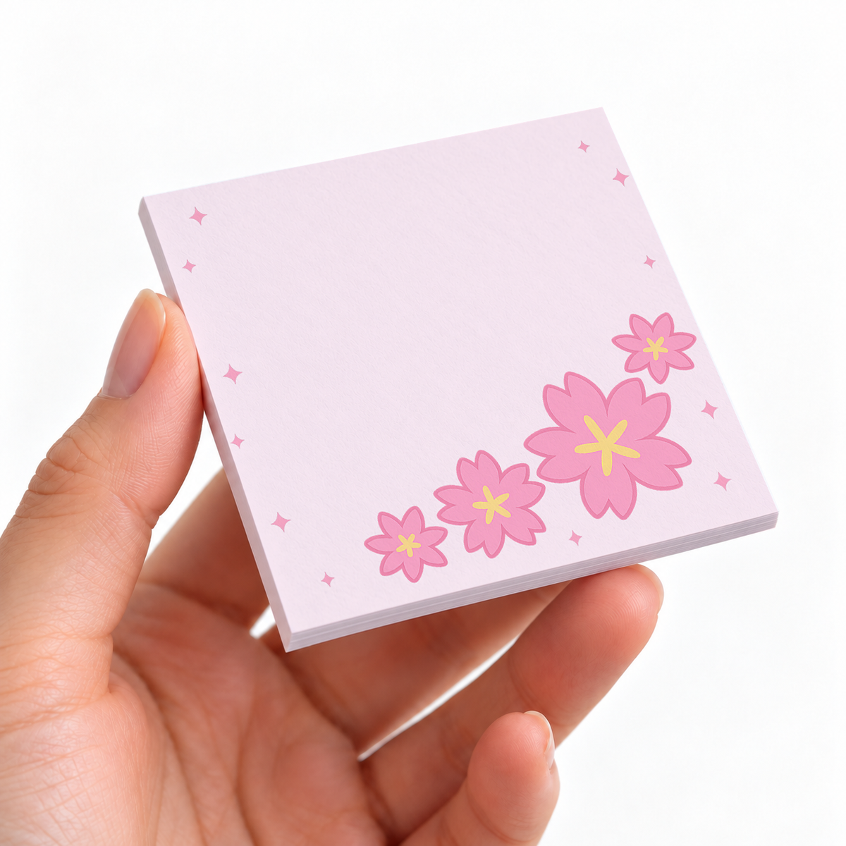 Sweeping Cherry Blossom sticky note pad on a desk with stationery