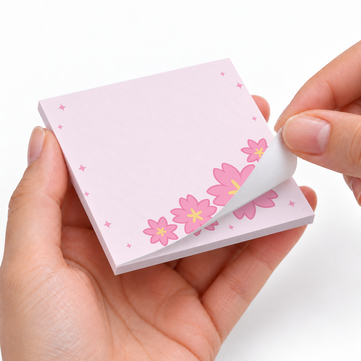 Sweeping Cherry Blossom sticky notes styled with a planner and desk accessories