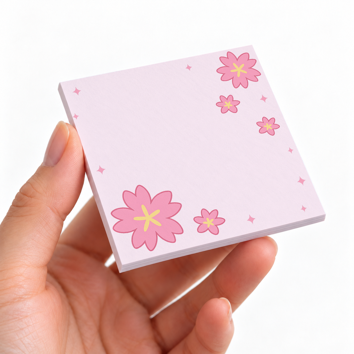 Bold Sakura Bloom sticky note pad on a desk with stationery