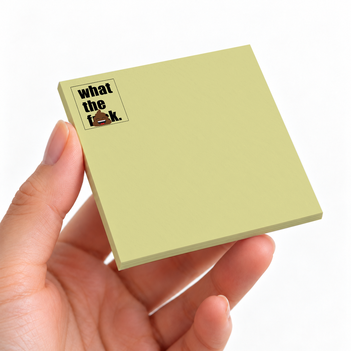 What The F sticky note pad on a desk with stationery