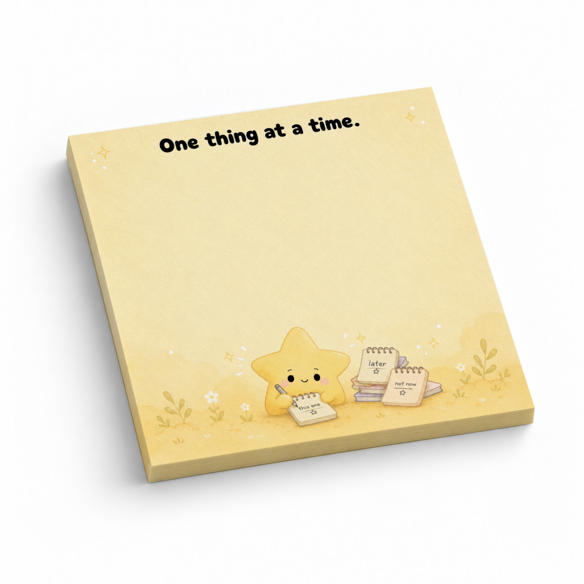 Yellow 3 x 3 inch sticky note pad reading “One thing at a time,” with a cute star illustration on white.