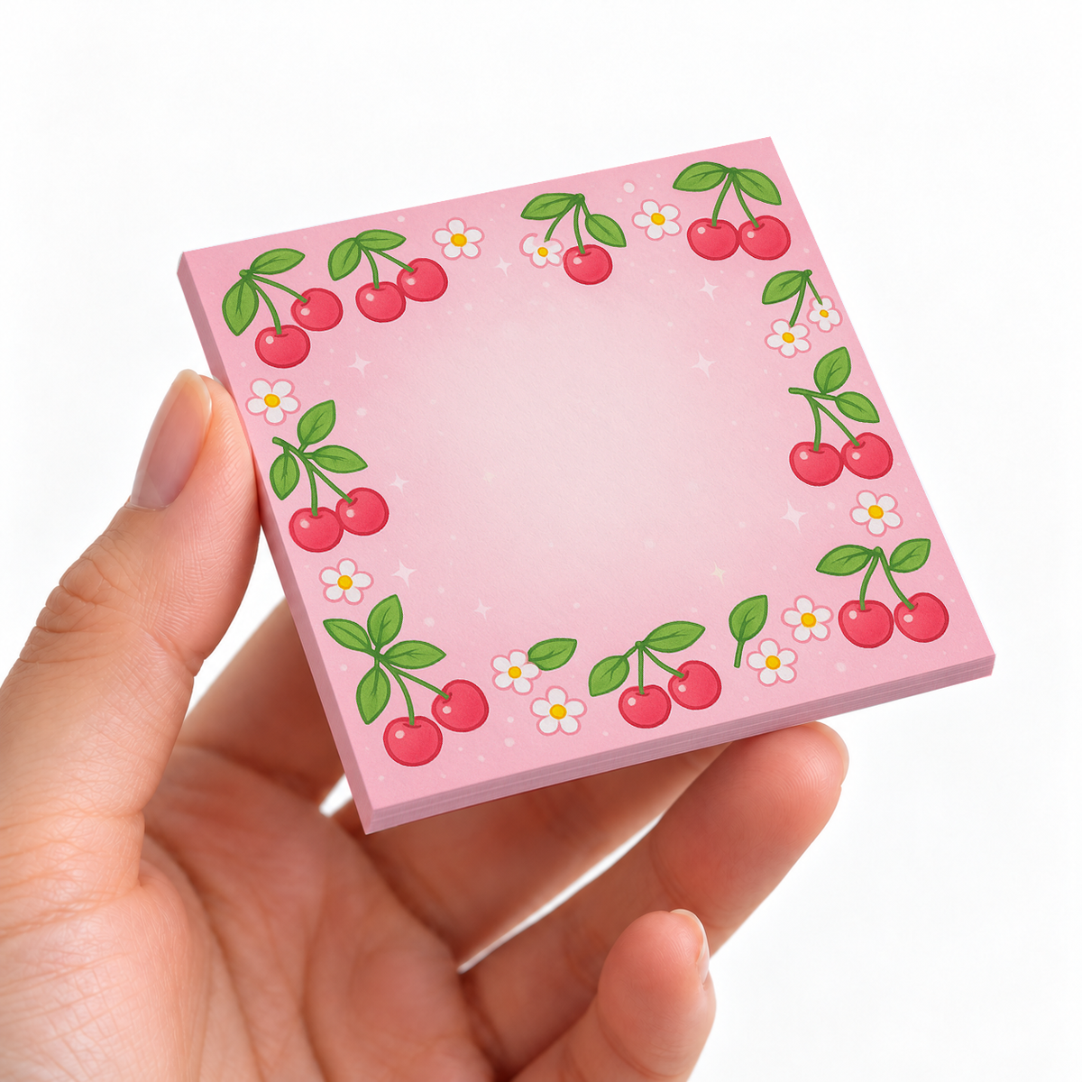 Sweet Cherry Blossom sticky note pad on a desk with stationery