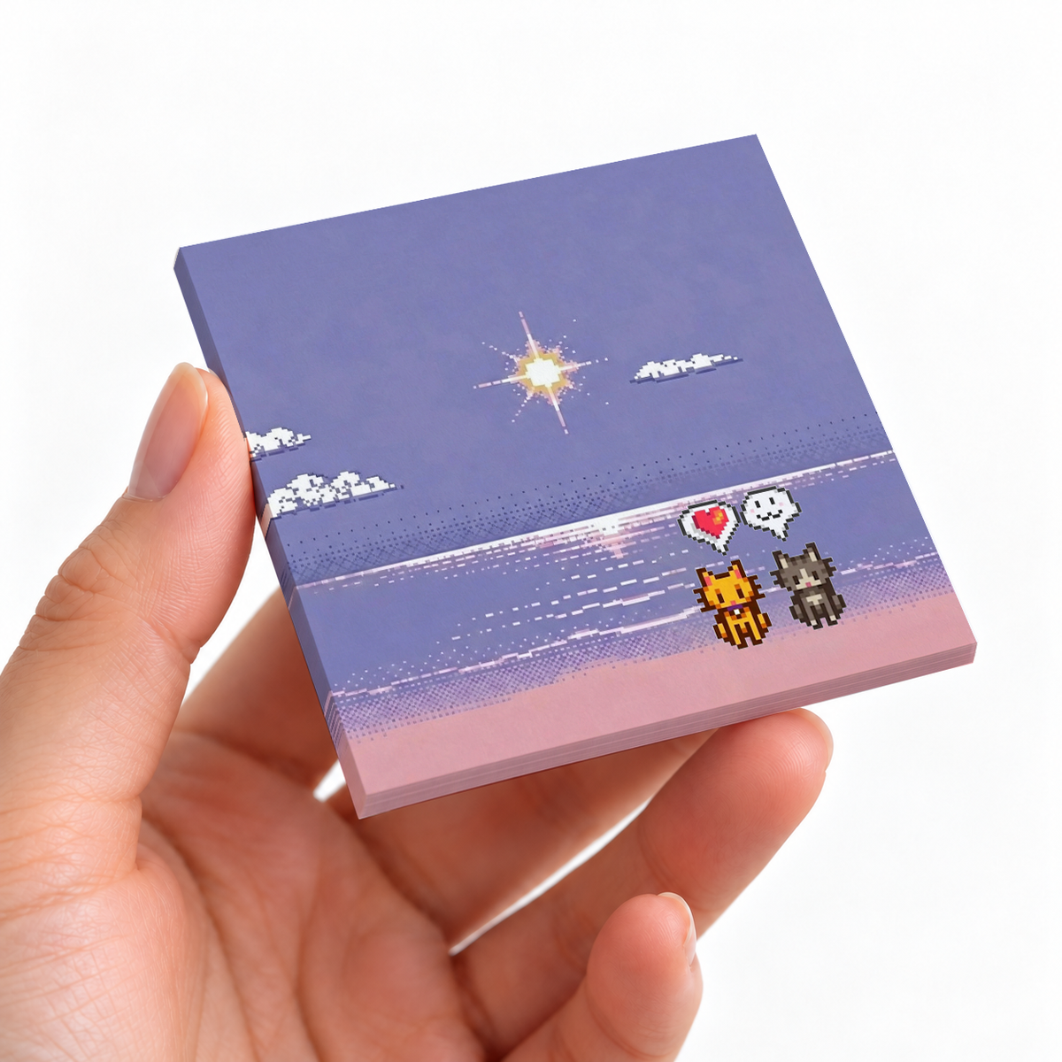 Pixel Art Beach Cats sticky note pad on a desk with stationery