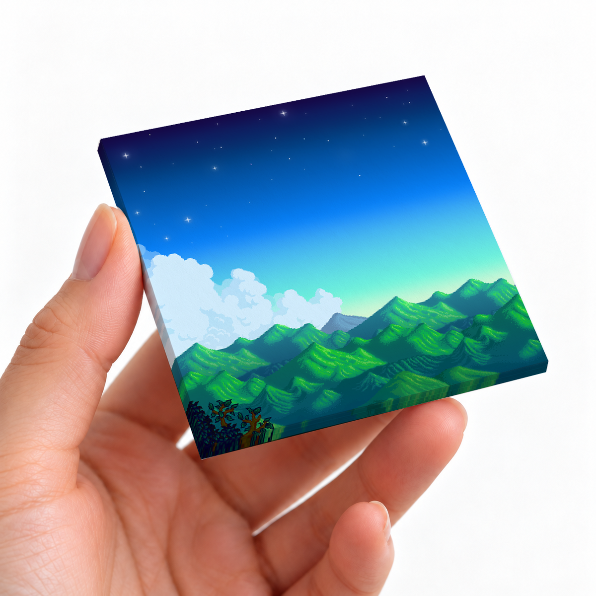 Pixel Art Mountain Night sticky note pad on a desk with stationery