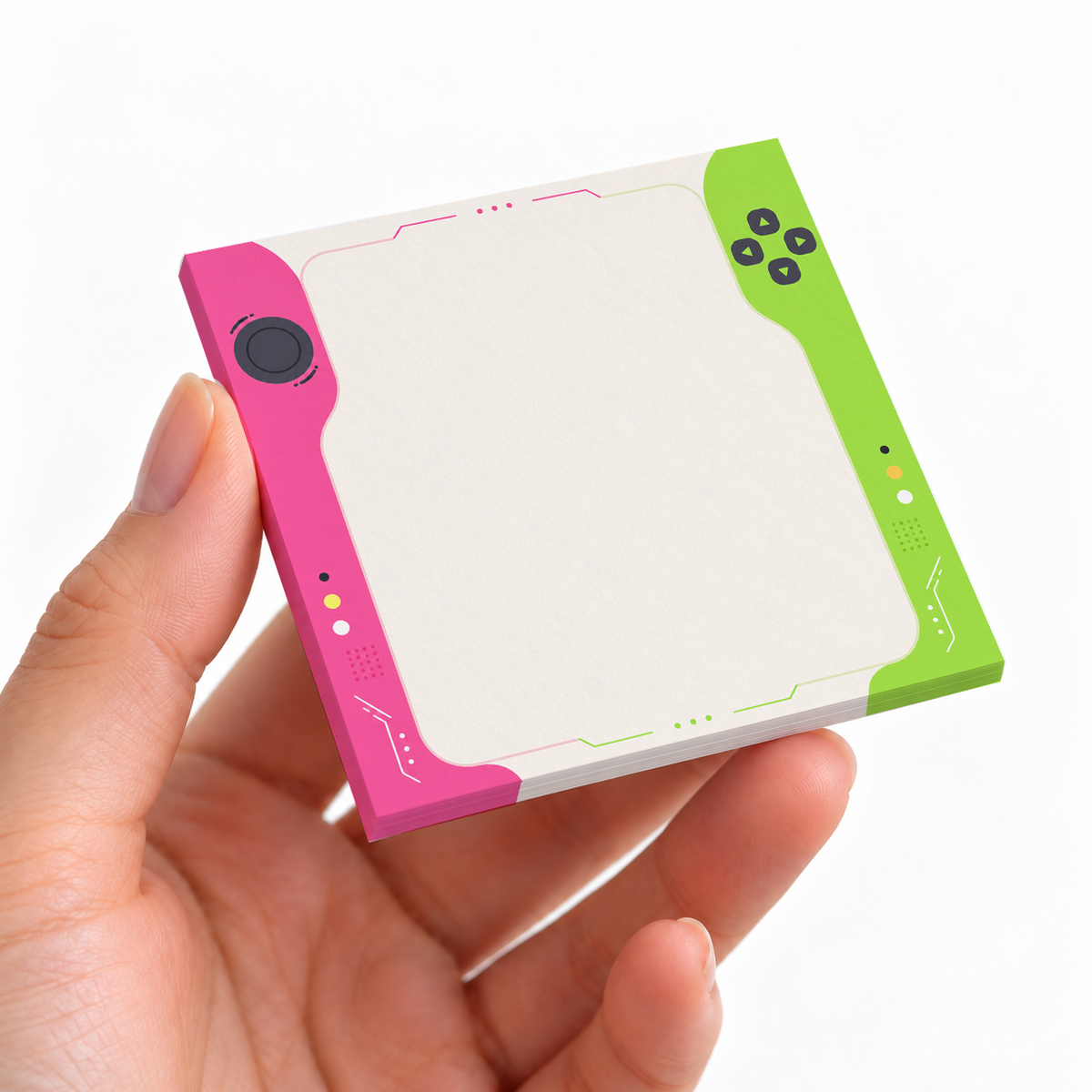 Pink and Green Handheld Console sticky note pad on a desk with stationery